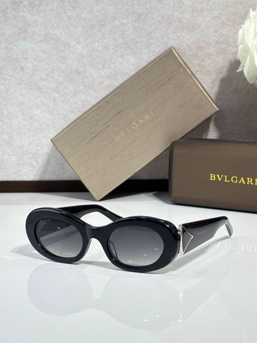 Bvlgari sunglasses, black oval frame with dark lenses and gold logo detail