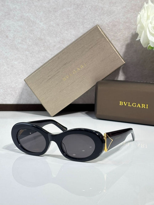 BVLGARI oval sunglasses with dark lenses and glossy black frames, gold accents
