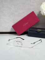 Cartier eyeglasses with clear lenses and thin gold metal frames