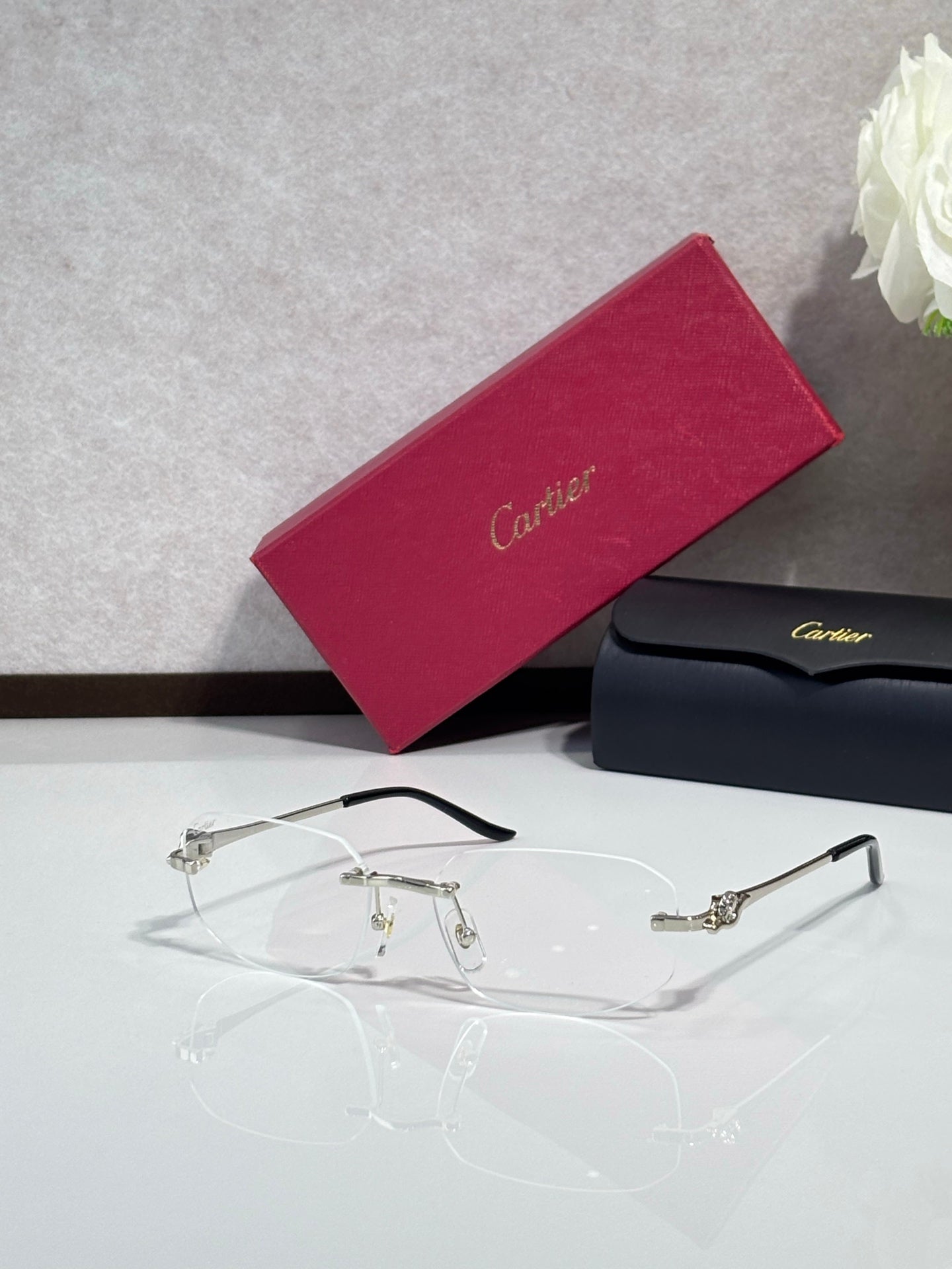 Cartier eyeglasses with clear lenses and thin gold metal frames