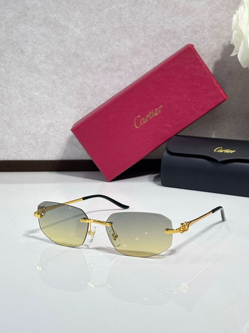Cartier sunglasses with gold metal frame, dark temples, and light amber tinted lenses