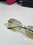 Cartier sunglasses front view with gold metal frame and light amber tinted lenses