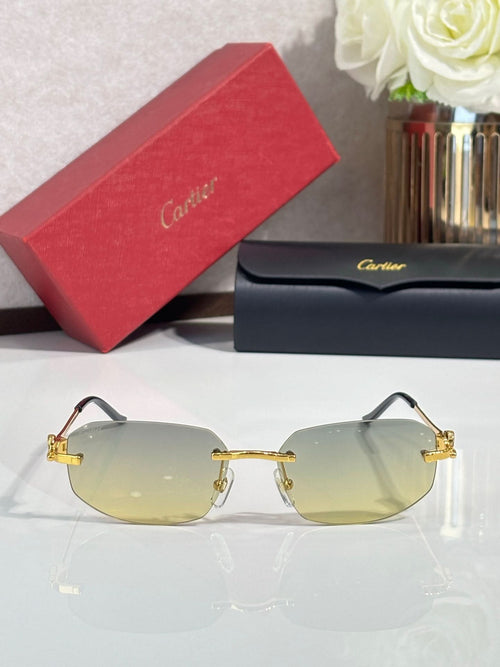Cartier sunglasses, gold rim and hinges, clear-to-light amber lenses with dark temples