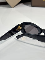 BVLGARI sunglasses angled view with dark lenses and gold-tone front hinge
