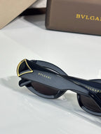 BVLGARI sunglasses side view with dark lenses and gold-trimmed top edge