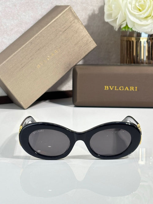 BVLGARI oval sunglasses with dark lenses, black frame and gold corner details