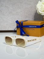 Sunglasses with white frame and tinted lenses, silver chain detail on arms