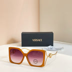 Versace sunglasses, orange square frames with gold Medusa temple detail, tinted lenses