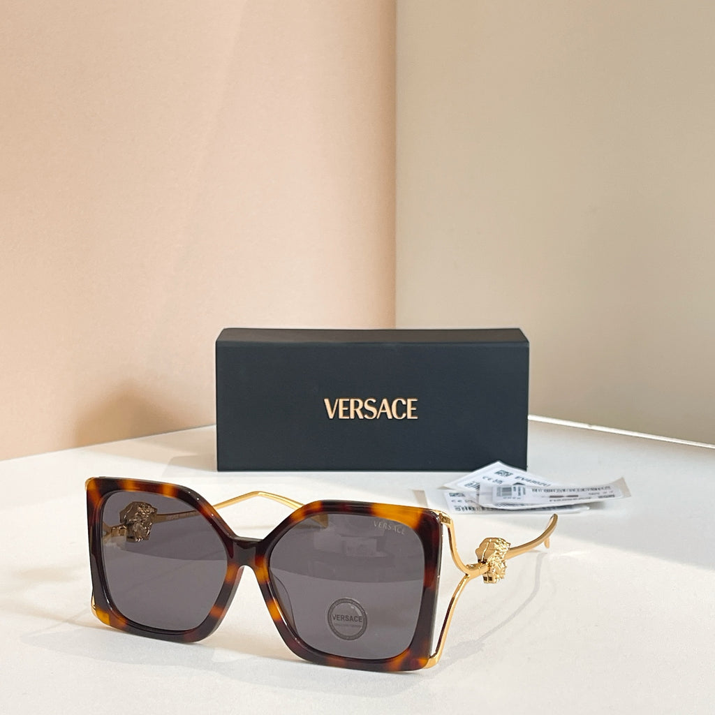 Versace sunglasses, dark tortoiseshell square frames with gold Medusa temple detail, tinted lenses