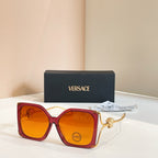 Versace sunglasses, red oversized square frames with gold Medusa temple detail, tinted lenses