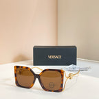 Versace sunglasses, tortoiseshell square frames with gold Medusa temple detail, tinted lenses