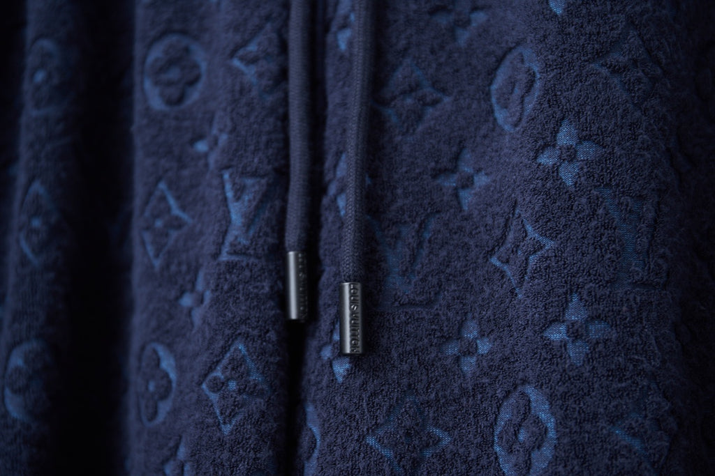 Navy patterned shorts with all-over signature-style motifs