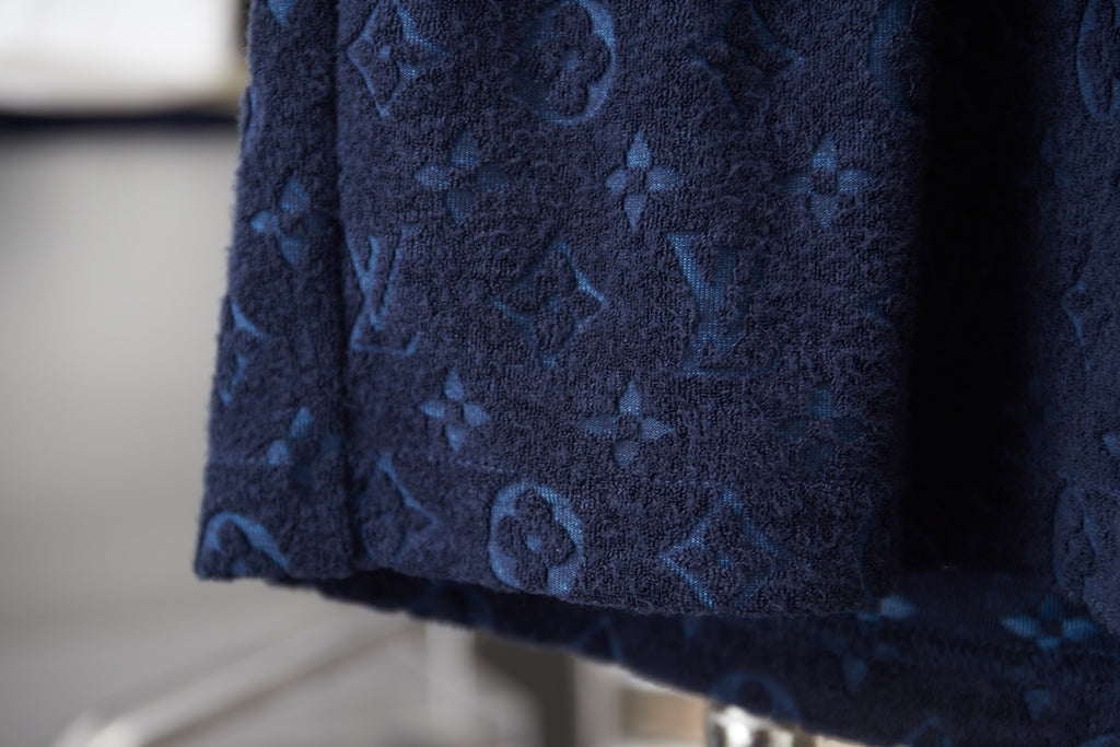 Navy patterned shorts hem detail with dense motif print
