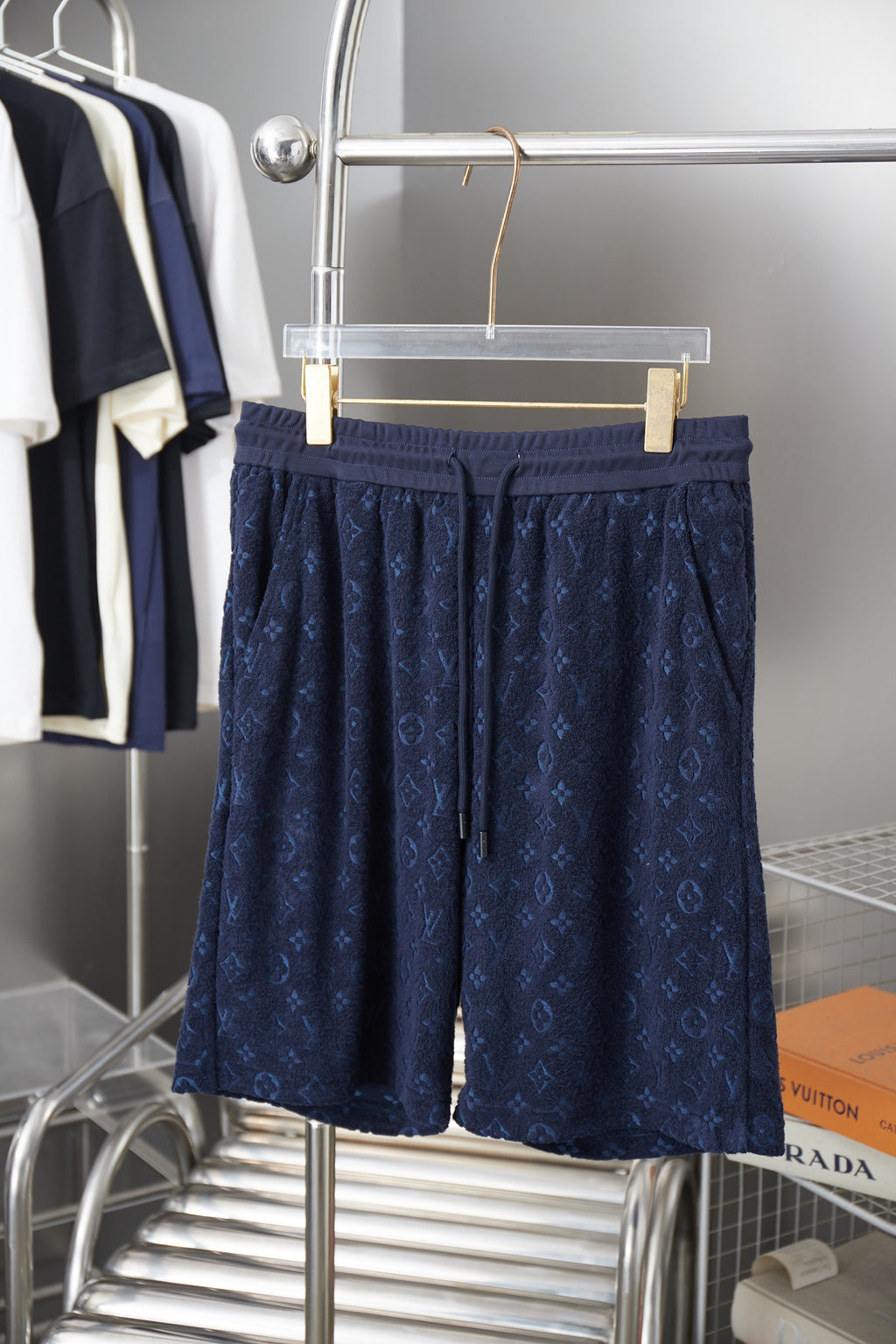 Navy patterned drawstring shorts with elastic waistband and side pockets