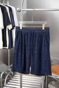 Navy patterned drawstring shorts with elastic waistband and side pockets