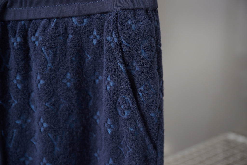 Navy patterned shorts front with pleats and drawstring tie