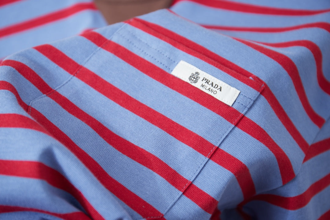 Prada striped polo shirt fabric with logo patch, light blue and red stripes