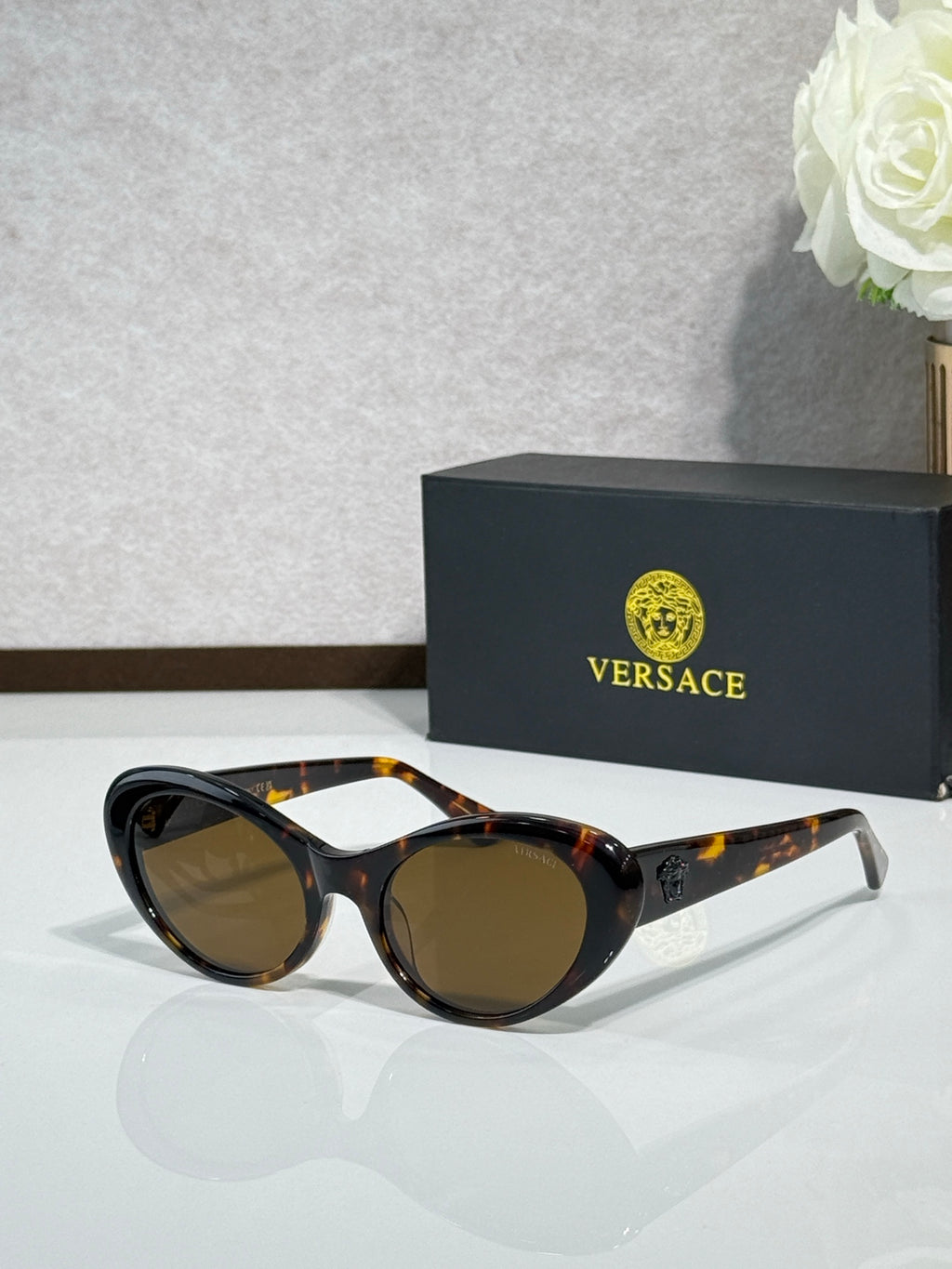 Versace tortoise sunglasses with brown lenses and metal front details