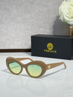 Versace sunglasses with light tan round frames and pale green lenses