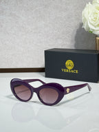 Versace sunglasses with purple round frames and mauve lenses