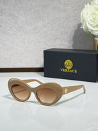 Versace sunglasses with beige round frames and tan lenses