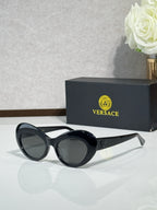 Versace sunglasses with black round frames and dark lenses