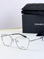 Silver metal eyeglasses with clear lenses, square frames, and dark temple tips