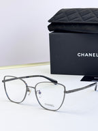 Black metal eyeglasses with square lenses and geometric temple details