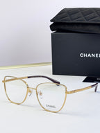 Gold metal eyeglasses with clear lenses and textured gold temples