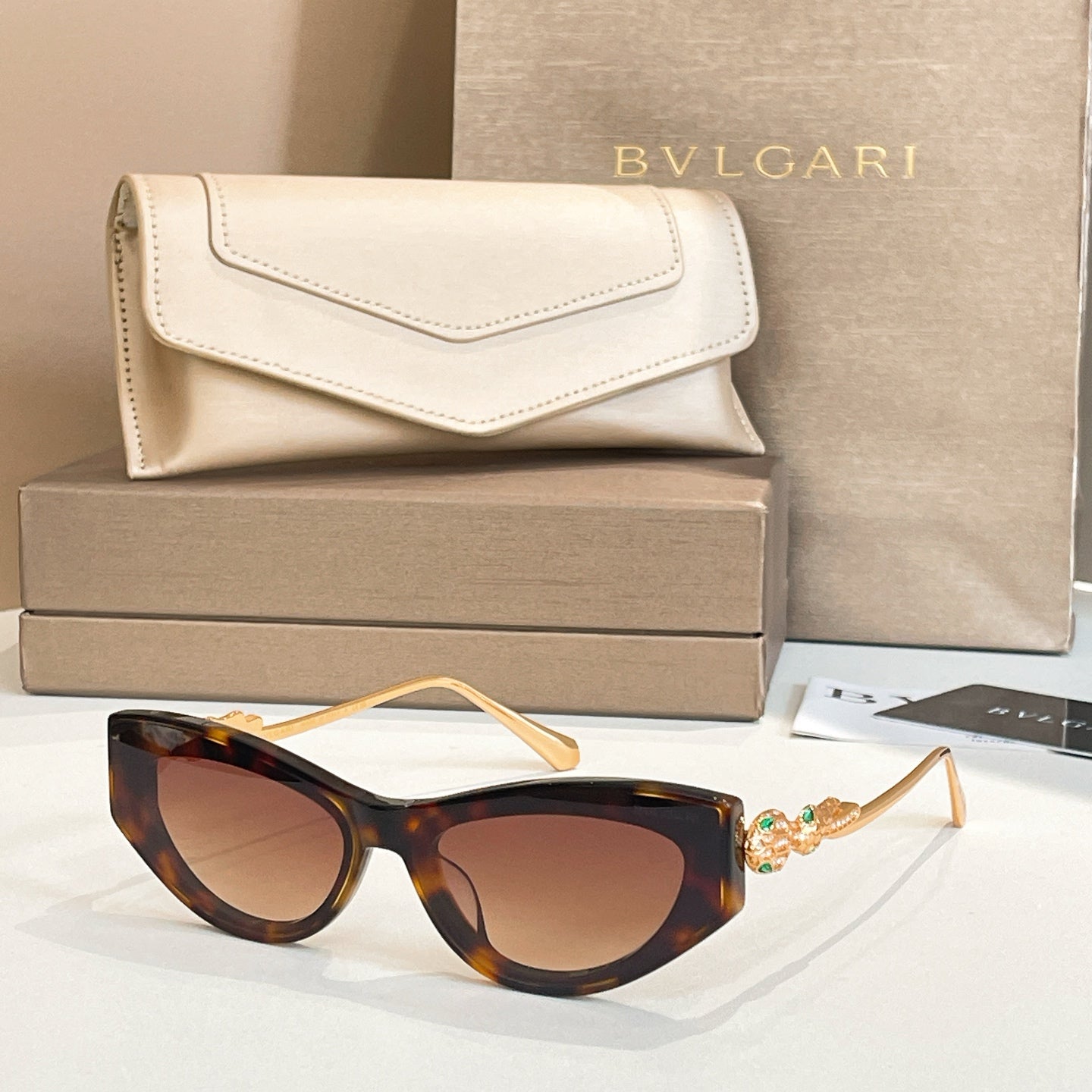 Bvlgari cat-eye sunglasses, tortoise frame with warm amber lenses and gold arms
