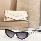 Bvlgari cat-eye sunglasses, black frame with dark lenses and light gold arms