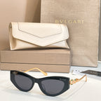 Bvlgari cat-eye sunglasses, black frame with dark lenses and gold arms