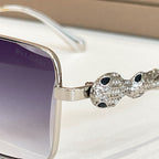 Square sunglasses bridge with rhinestone owl charm and metal frame edge detail