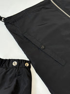 Close-up of kids black jacket hooded style with snap and zipper hardware