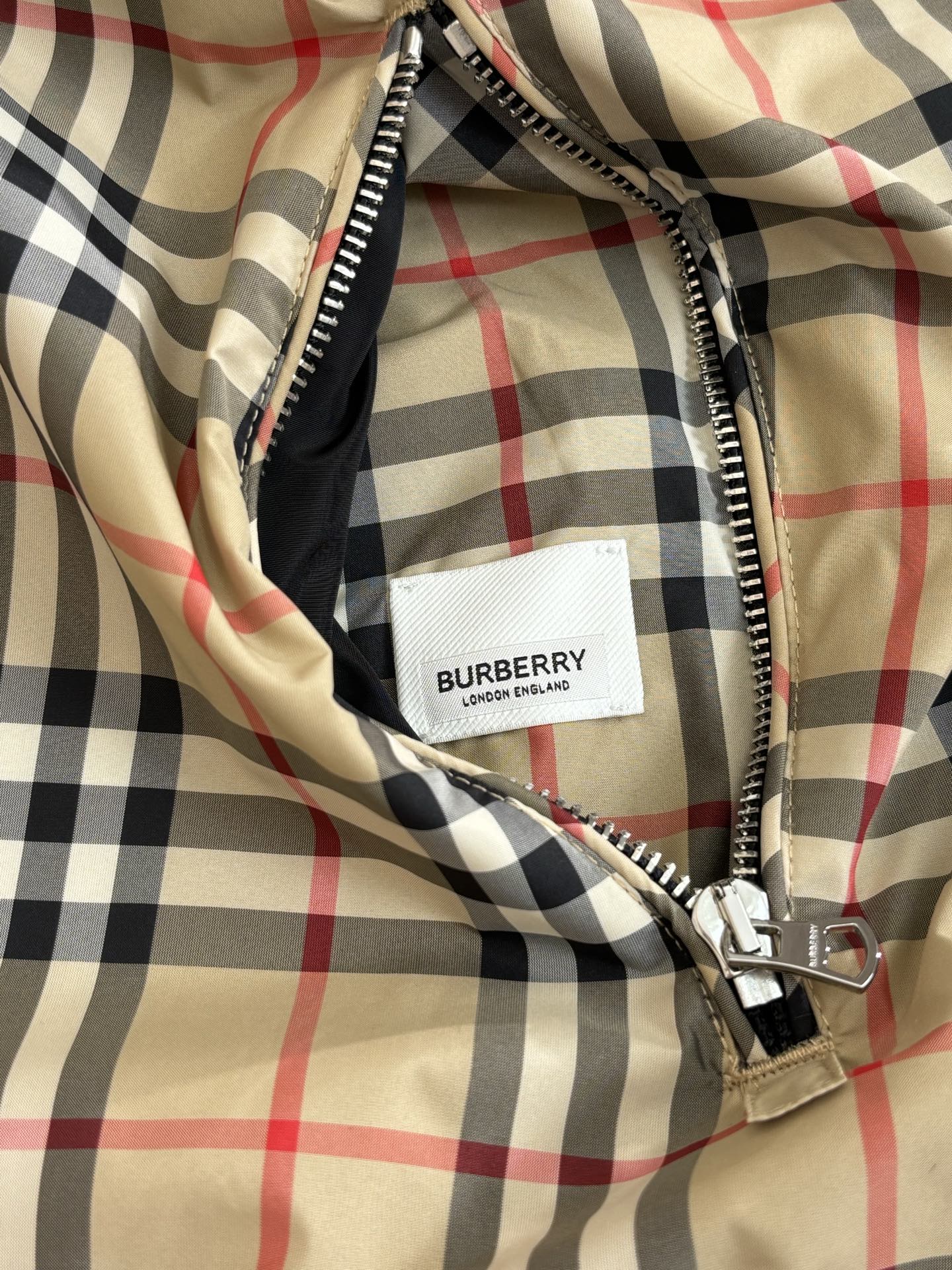 Black-and-beige Burberry check jacket with front zipper and logo label