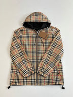 Kids hooded plaid jacket with zip front, button cuffs, and drawstring hem