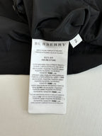 Black jacket with Burberry size and care label on inside collar