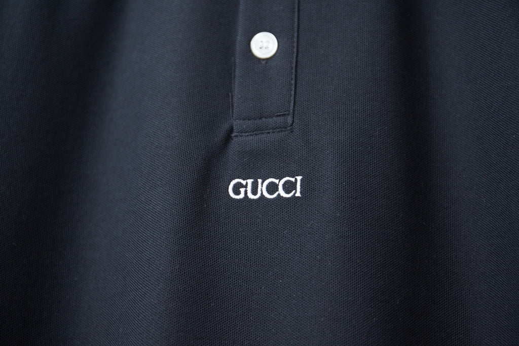 Gucci polo shirt chest logo on navy fabric with buttoned placket