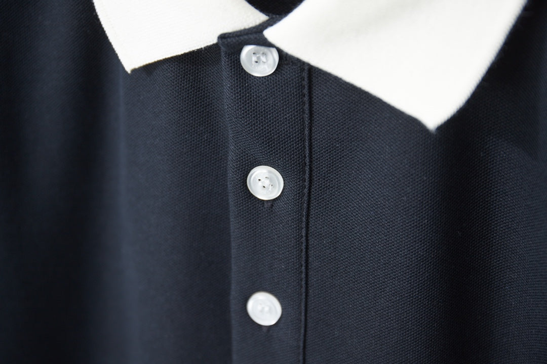 Gucci polo shirt placket with white buttons and white ribbed collar in navy