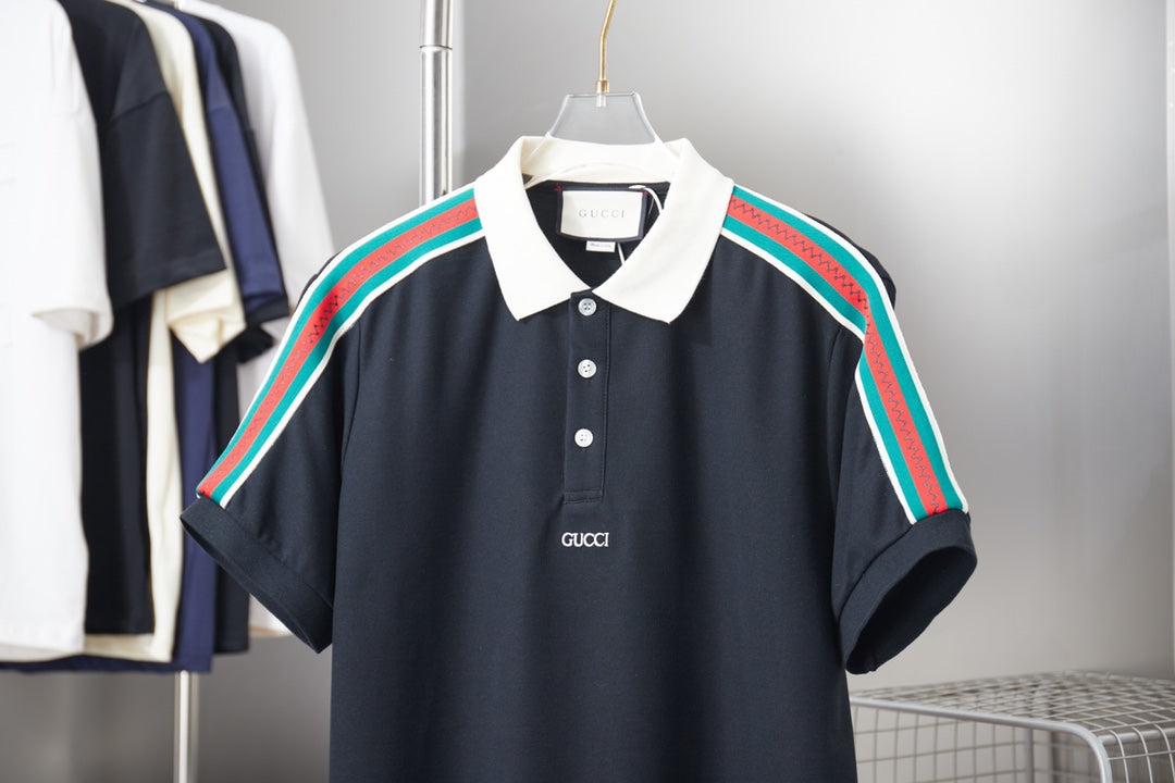 Gucci short-sleeve polo shirt with navy body, white collar, and multicolor shoulder stripes