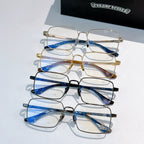 Set of metal eyeglasses with blue, gold, and black frames and clear lenses