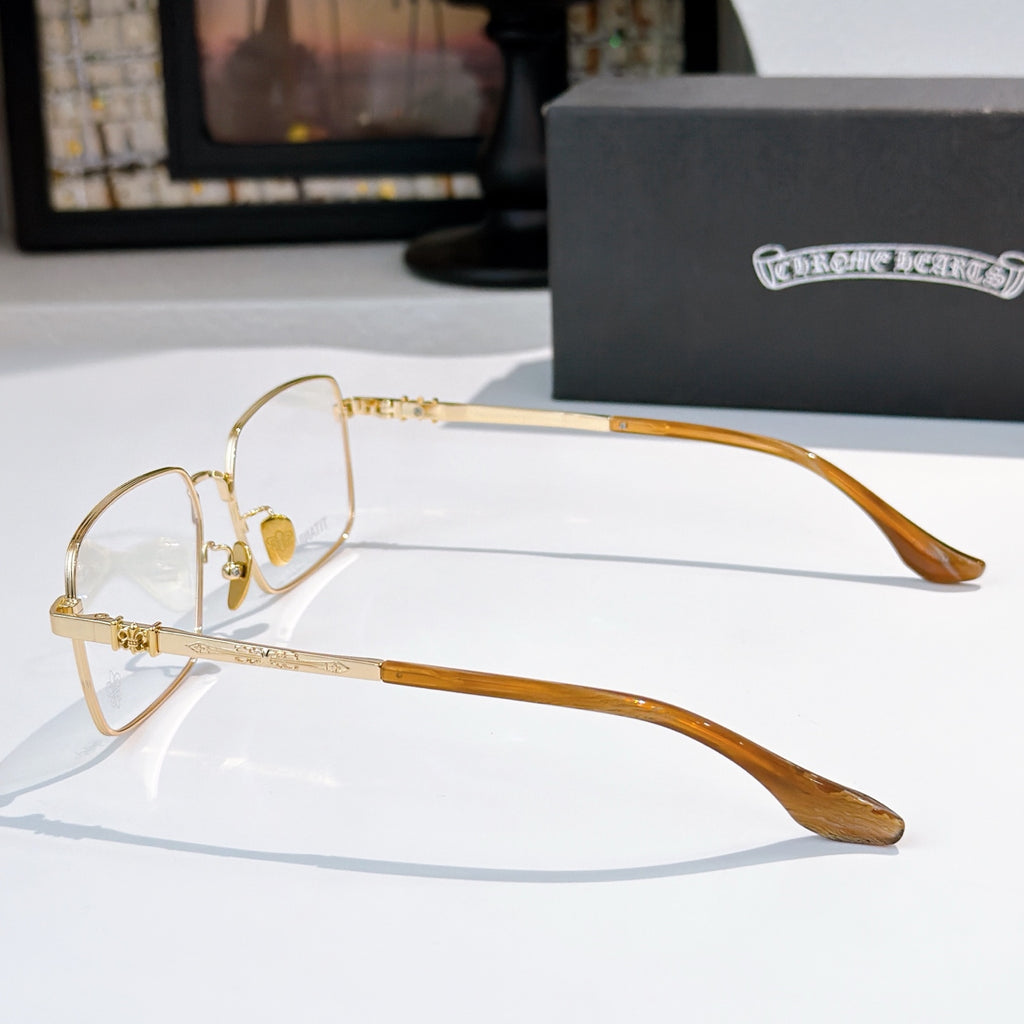Gold rectangular eyeglasses with long amber temples and clear lenses, side view