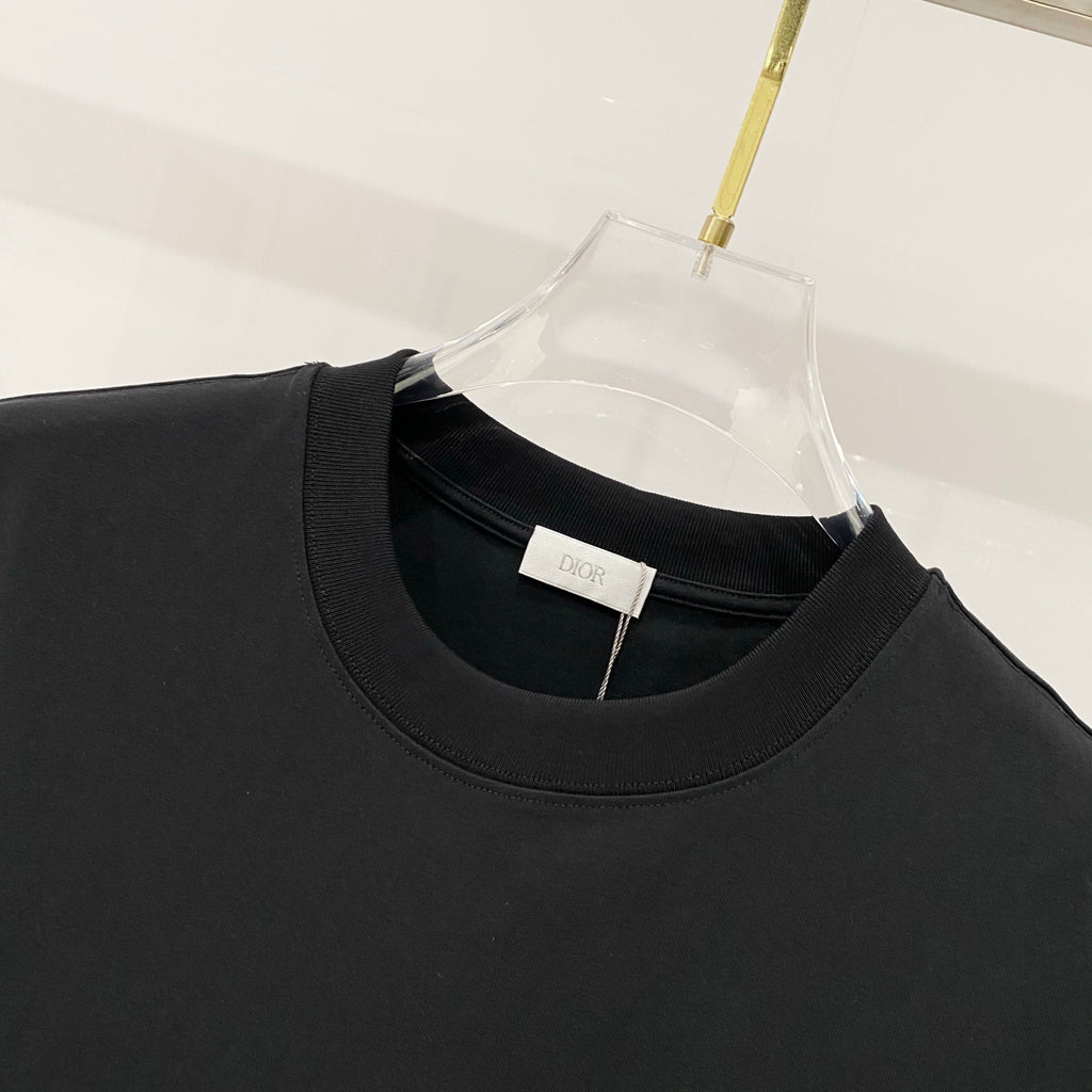 Black crew-neck T-shirt neckline with Dior label inside collar