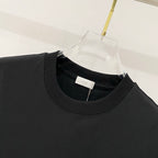 Black crew-neck T-shirt neckline with Dior label inside collar