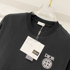 Black Dior crew-neck T-shirt with front emblem logo and size tags