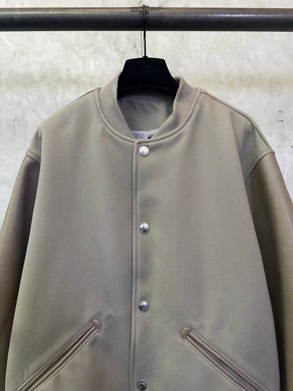 Olive long-sleeve jacket with stand collar and silver snap button placket