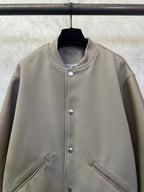 Olive long-sleeve jacket with stand collar and silver snap button placket