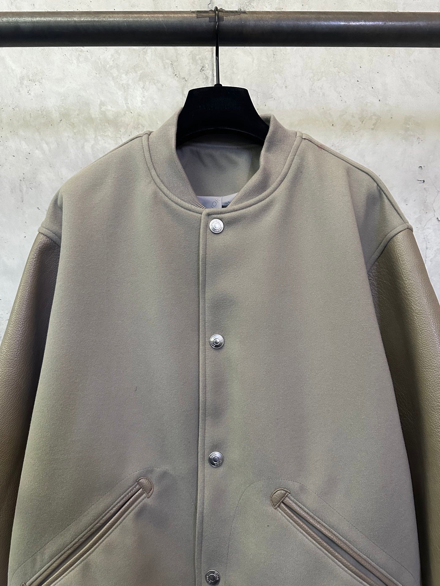 Olive long-sleeve jacket with stand collar and silver snap button placket
