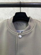 Olive long-sleeve jacket collar with snap button closure