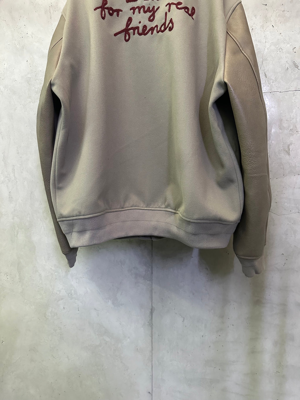 Olive jacket back with burgundy script print at upper back